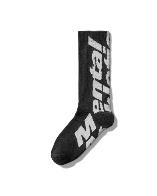 Side angle: Profile of white wool socks featuring oversized blue Mental Athletic branding.