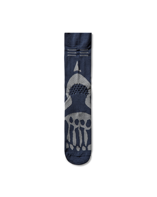 Front view of the ROA x Mental Athletic Bones Mid Sock in dark blue with contrast knit bone graphic along the foot.