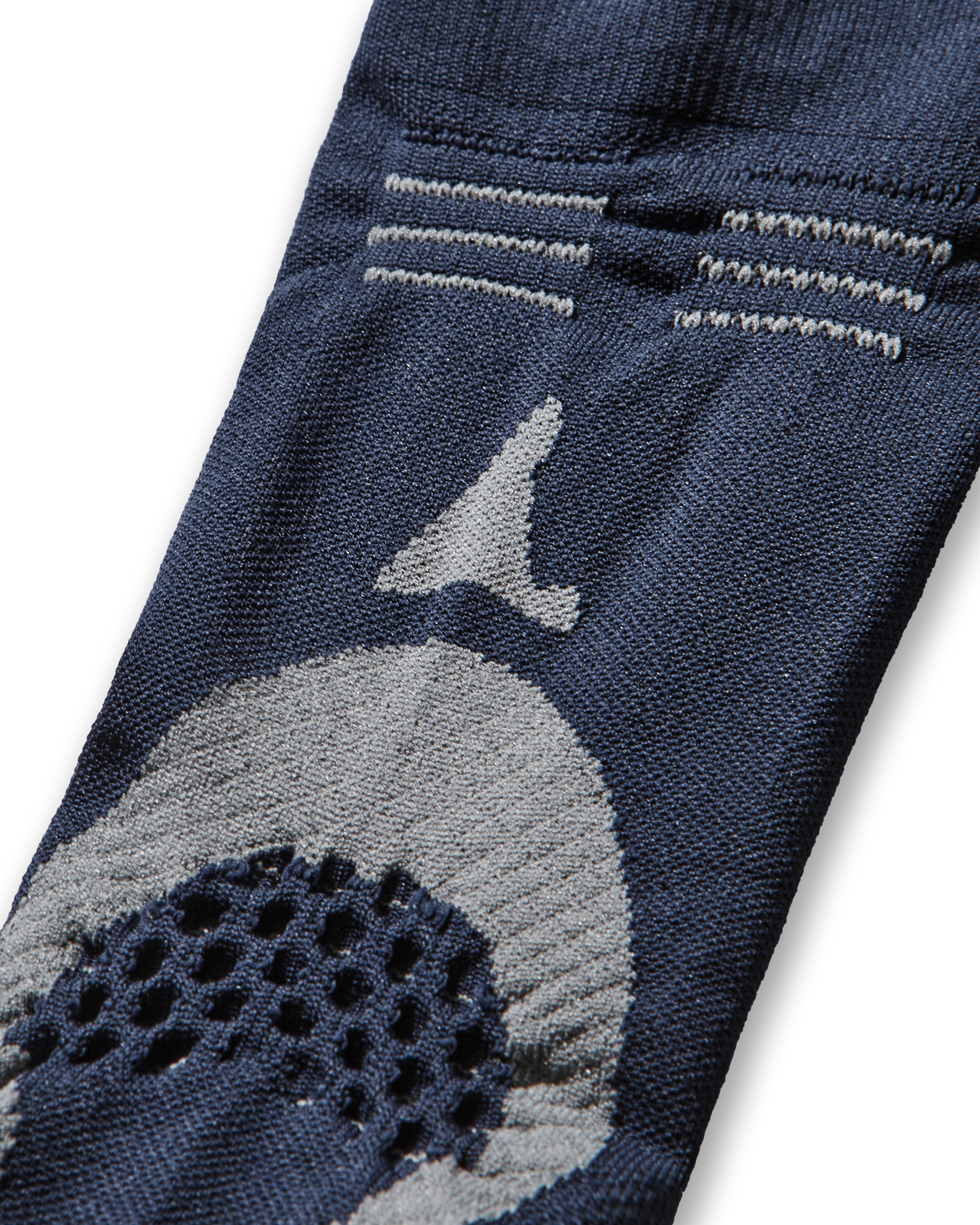 Close-up of the upper section of the sock showing the ROA logo and contrast knit texture.