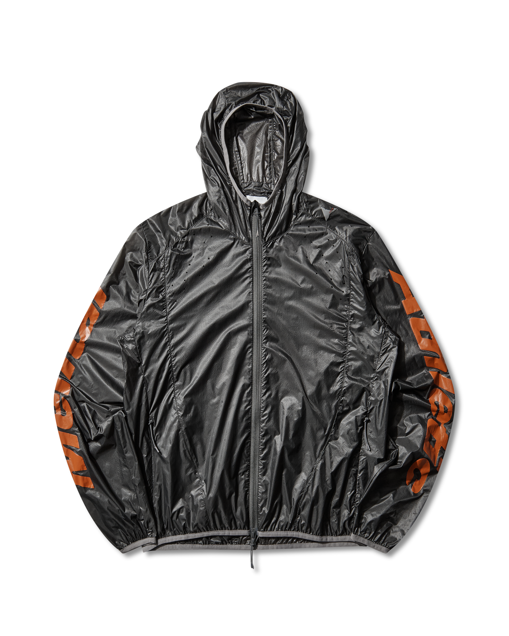 Front view of the black ROA x Mental Athletic Hue Packable Wind Jacket made from transparent micro ripstop nylon with orange logo details on the sleeves.