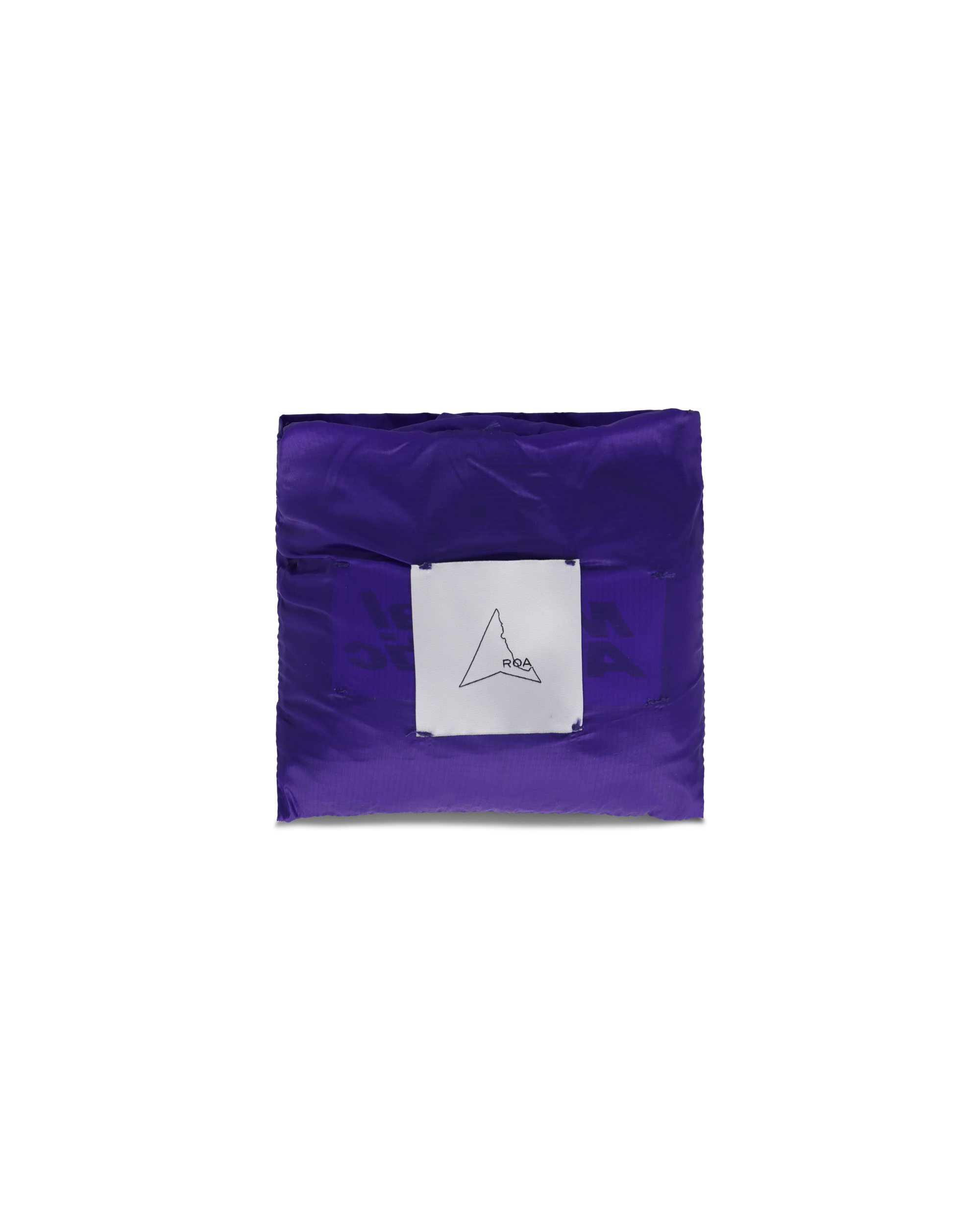 Flat lay of the folded purple ROA x Mental Athletic bag in its compact packable form with the ROA logo label.