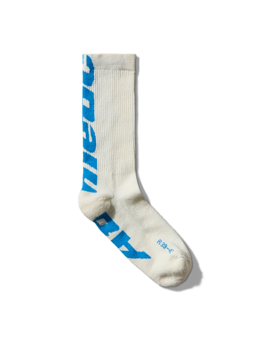 Sock full view: “Mental Athletic wool socks with blue logo, full frontal view.