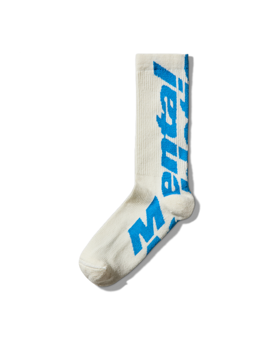 Side angle: Profile of white wool socks featuring oversized blue Mental Athletic branding.
