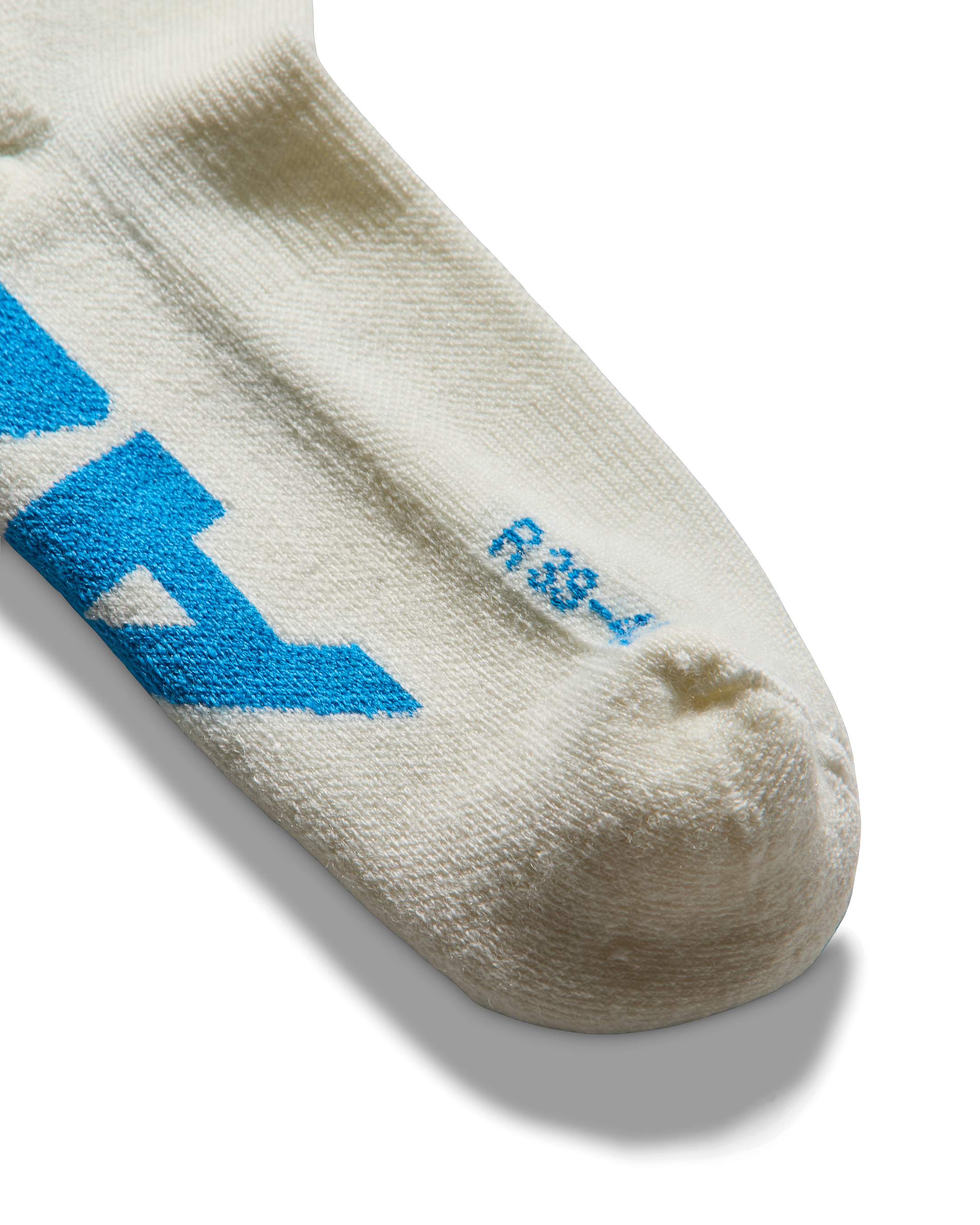 Toe detail: Close-up of sock toe with subtle blue logo detailing