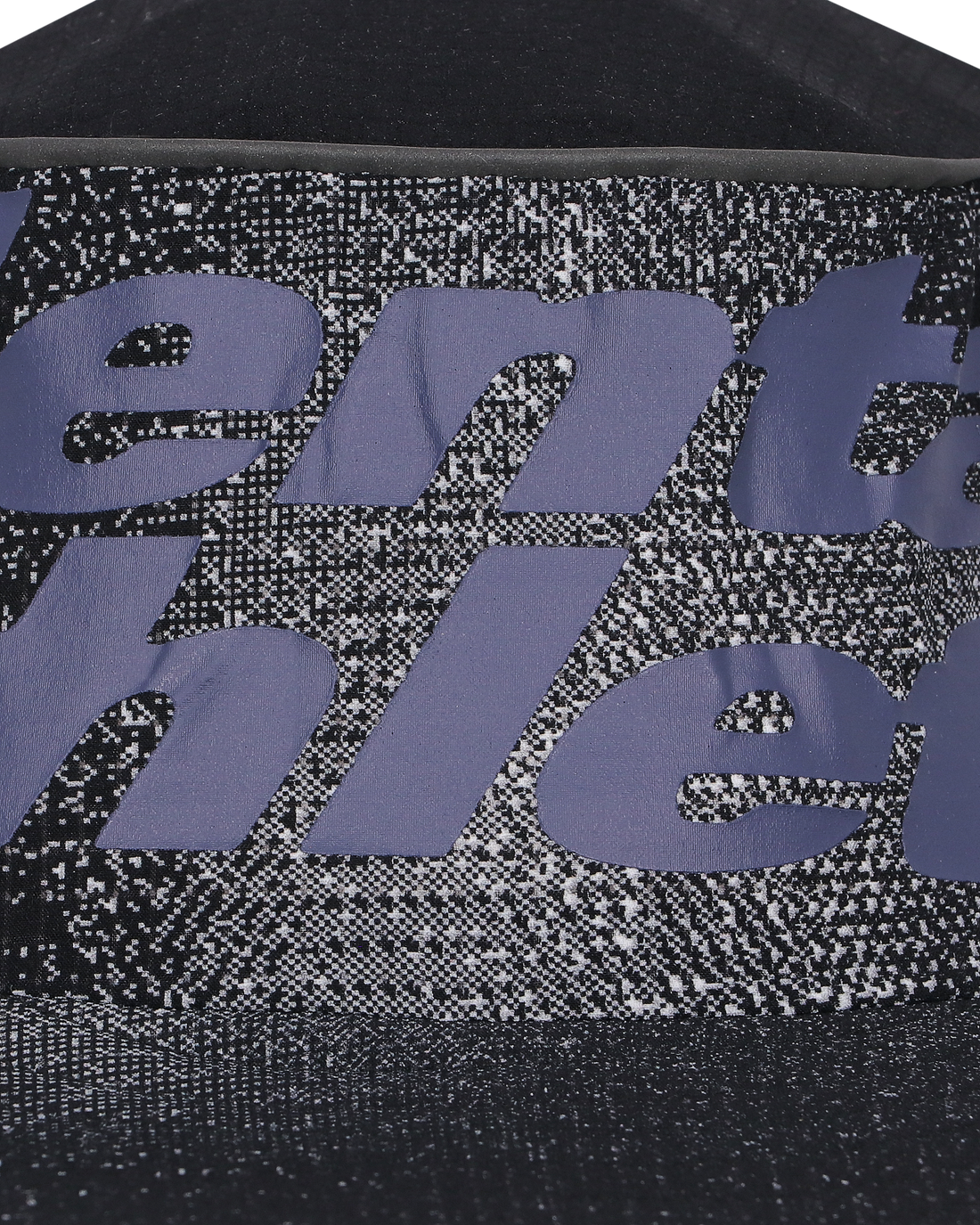 Close-up of breathable technical fabric and Mental Athletic CHILL SHIELD SPEED BOB branding, designed for trail running comfort