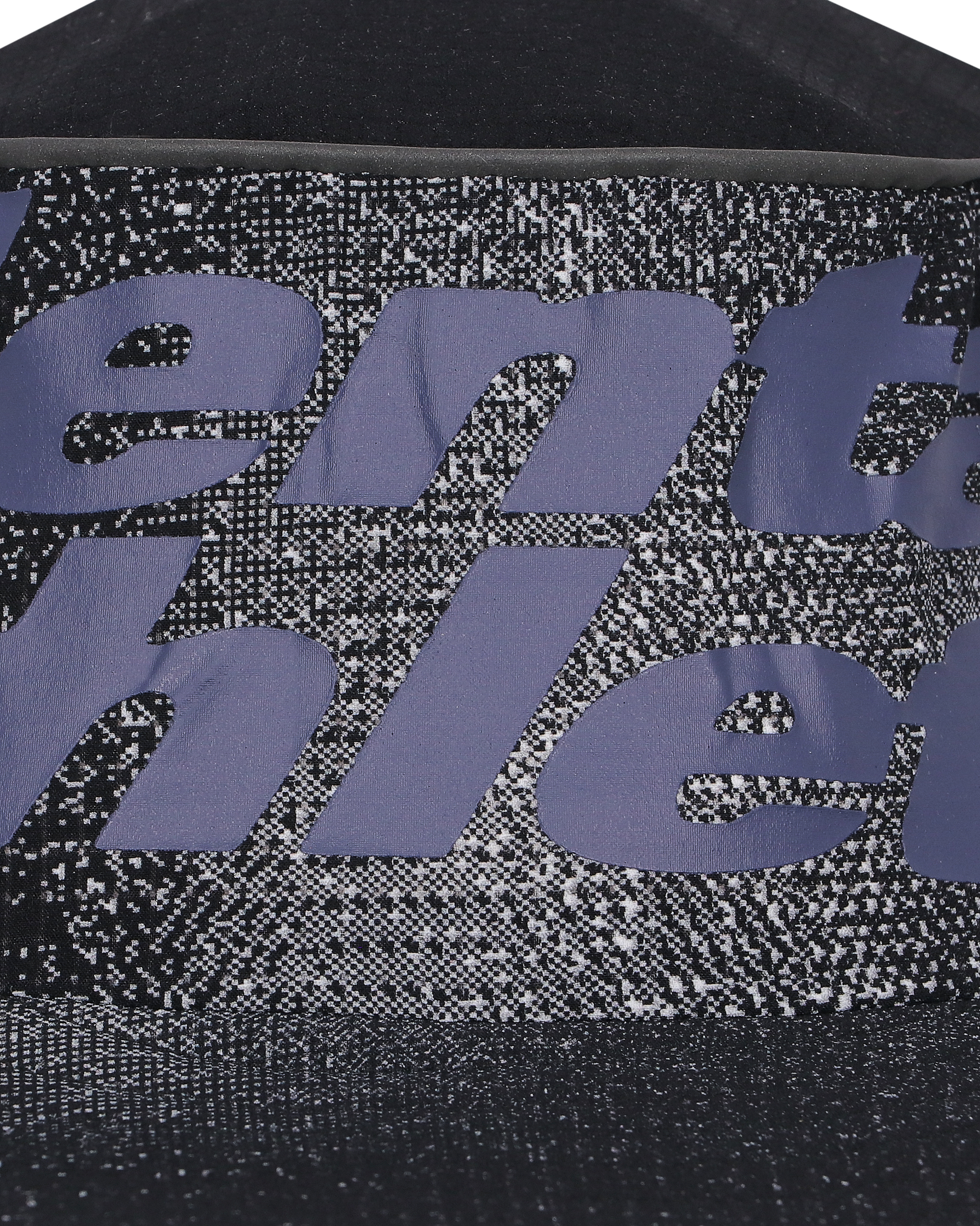 Close-up of breathable technical fabric and Mental Athletic CHILL SHIELD SPEED BOB branding, designed for trail running comfort