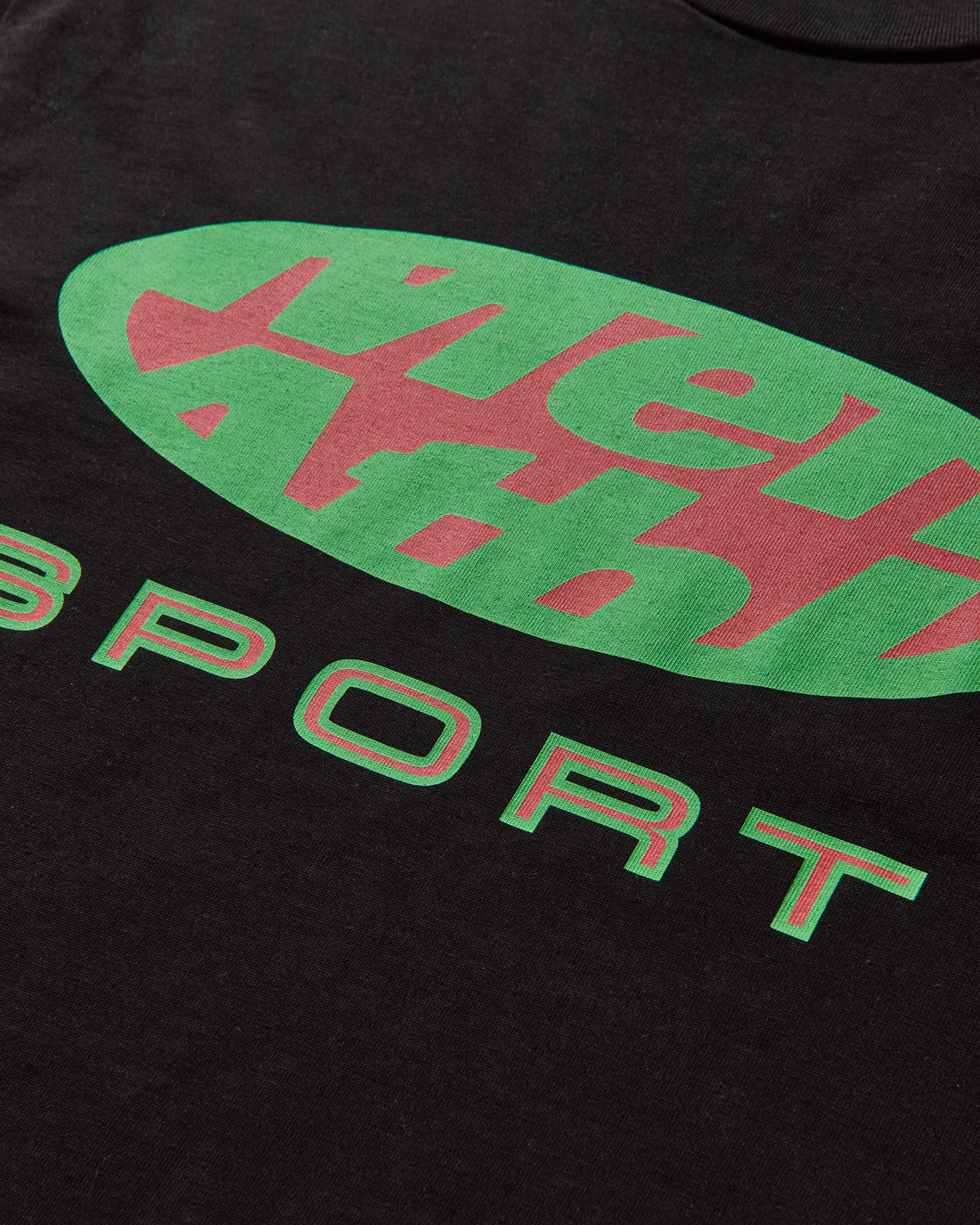 Close-up detail of SPORT TEE TOKYO Mental Athletic logo print on premium cotton fabric.