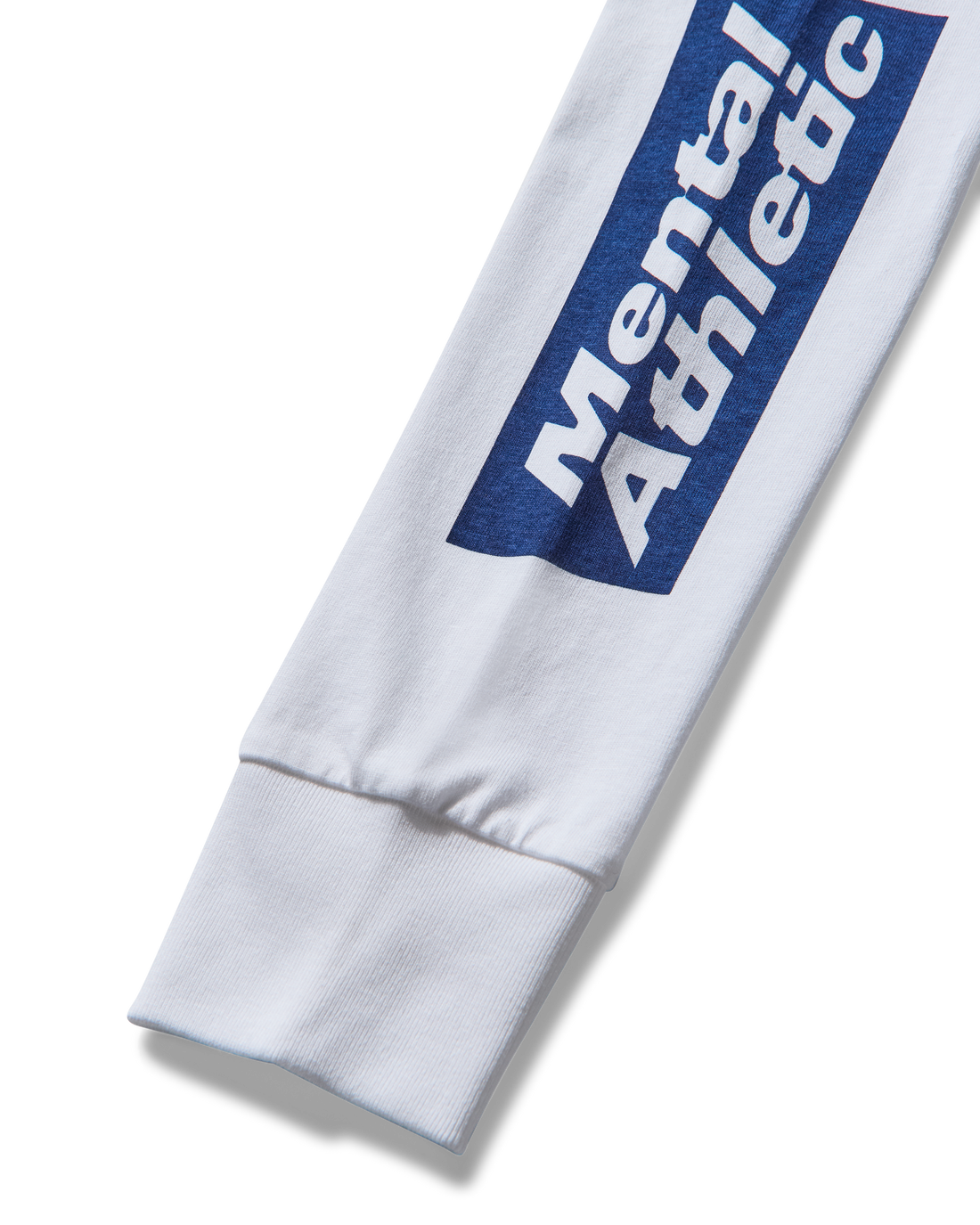 Close-up of sleeve monogram print and cotton texture.