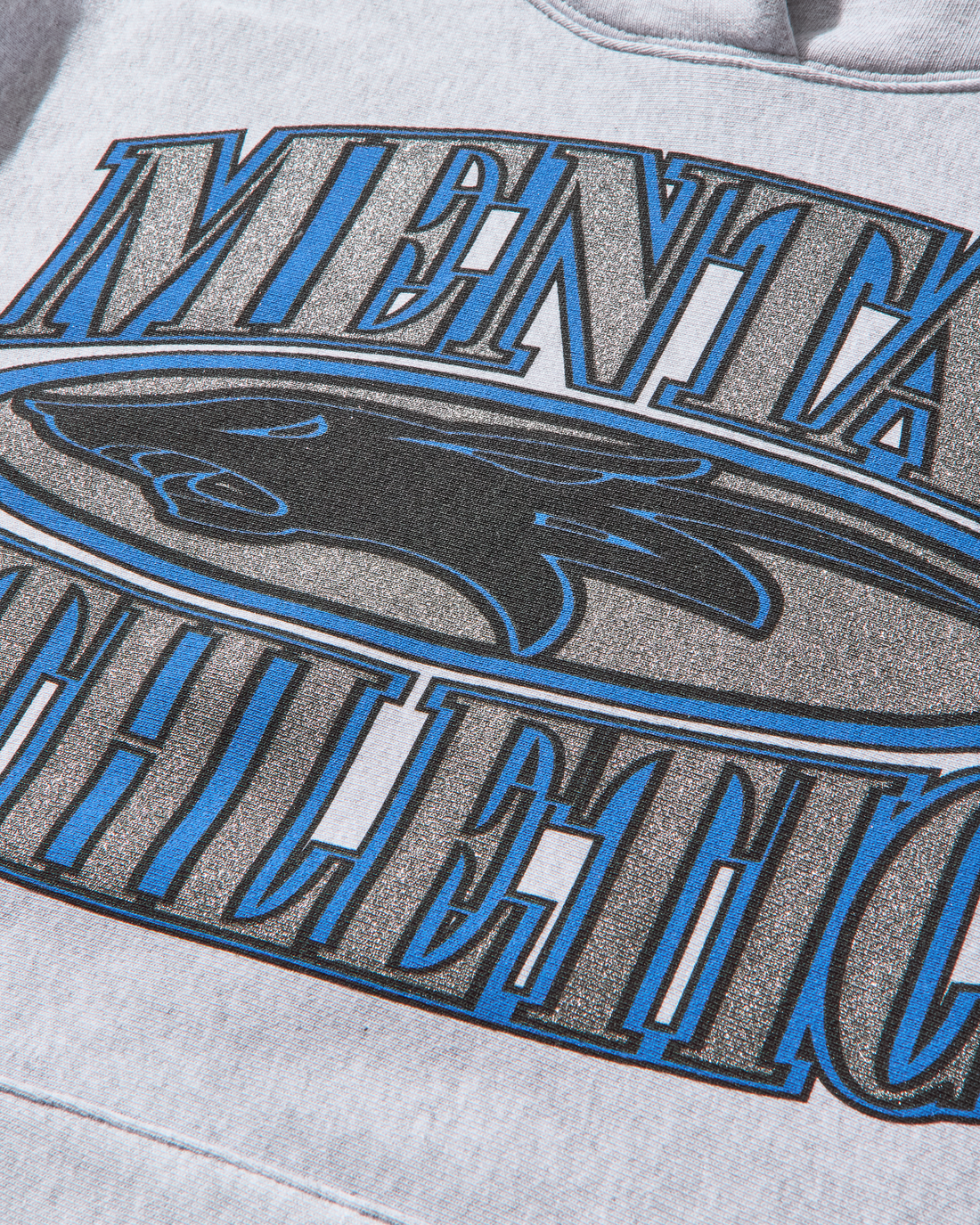 Close-up of wolf print design on Mental Athletic cotton sportswear hoodie.