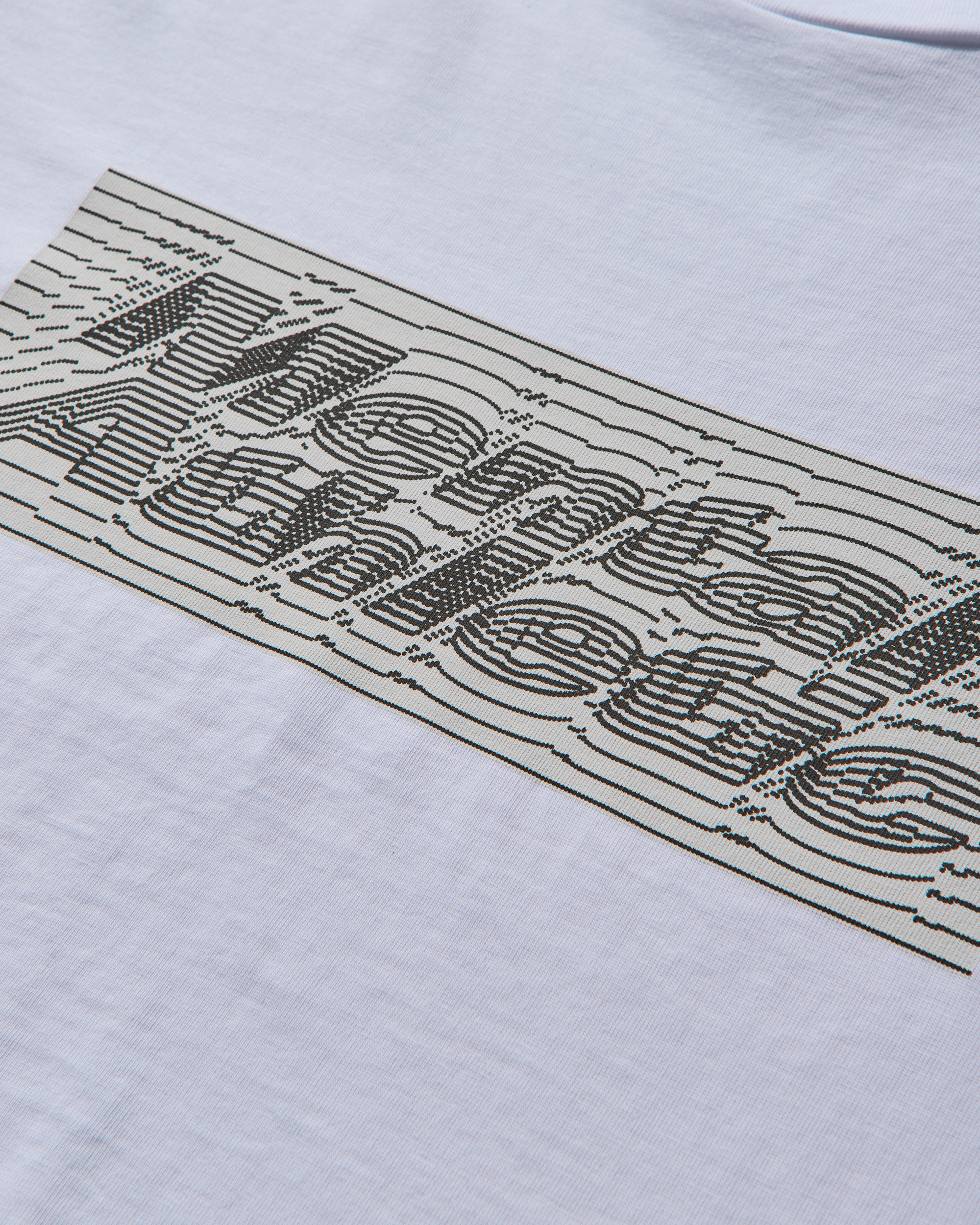 Close-up of Iguchi logo box print on Mental Athletic cotton sportswear t-shirt.