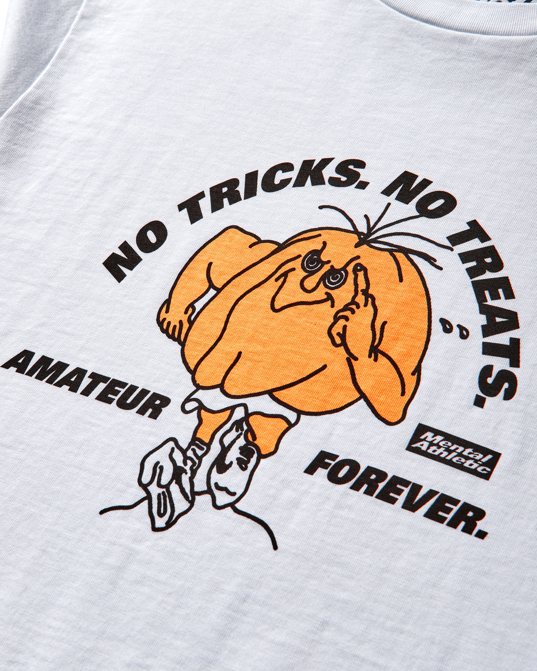 Detail of orange Halloween pumpkin graphic with running figure and Amateur Forever text.