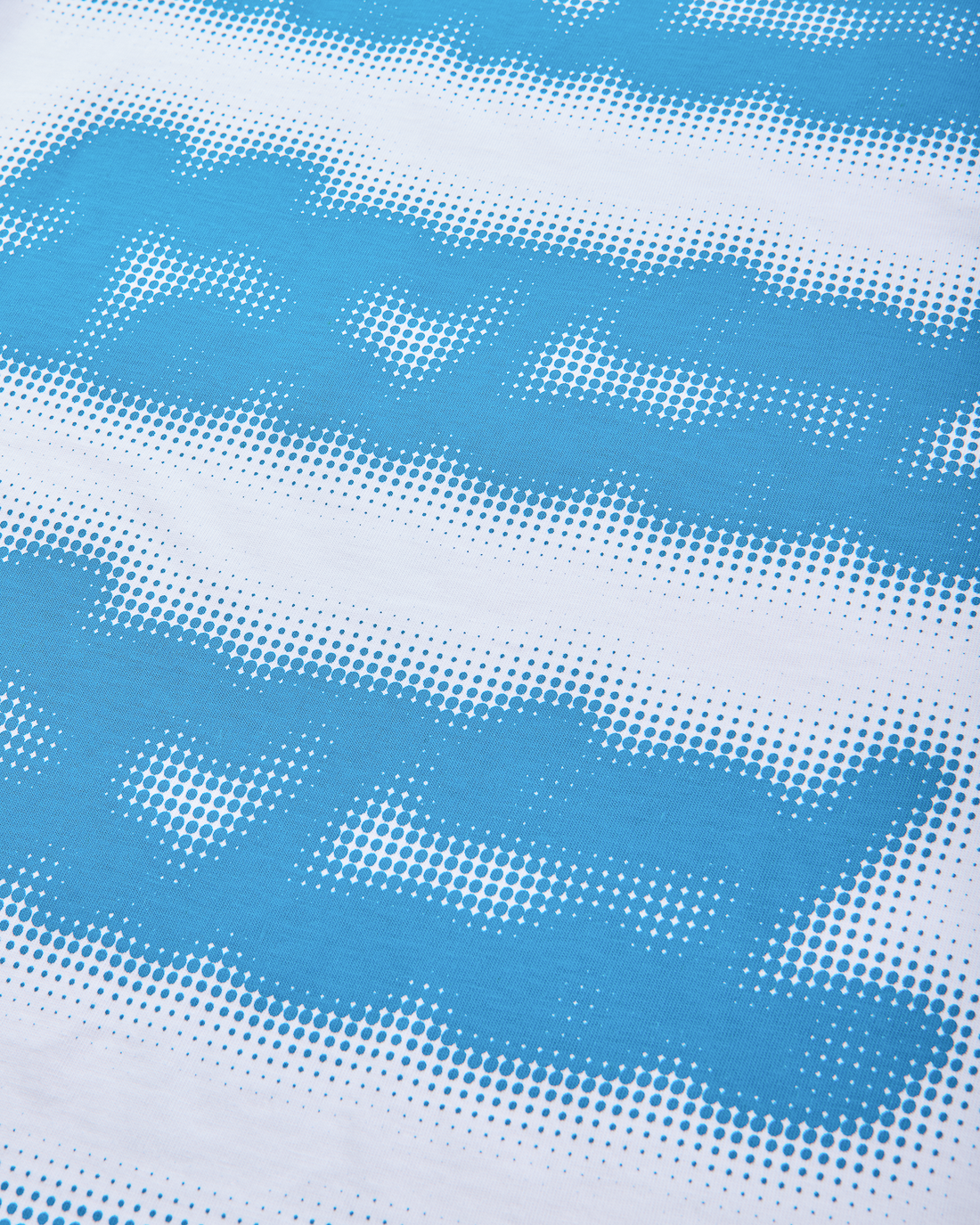 Mental Athletic white cotton t-shirt close-up of blue screenprint texture.
