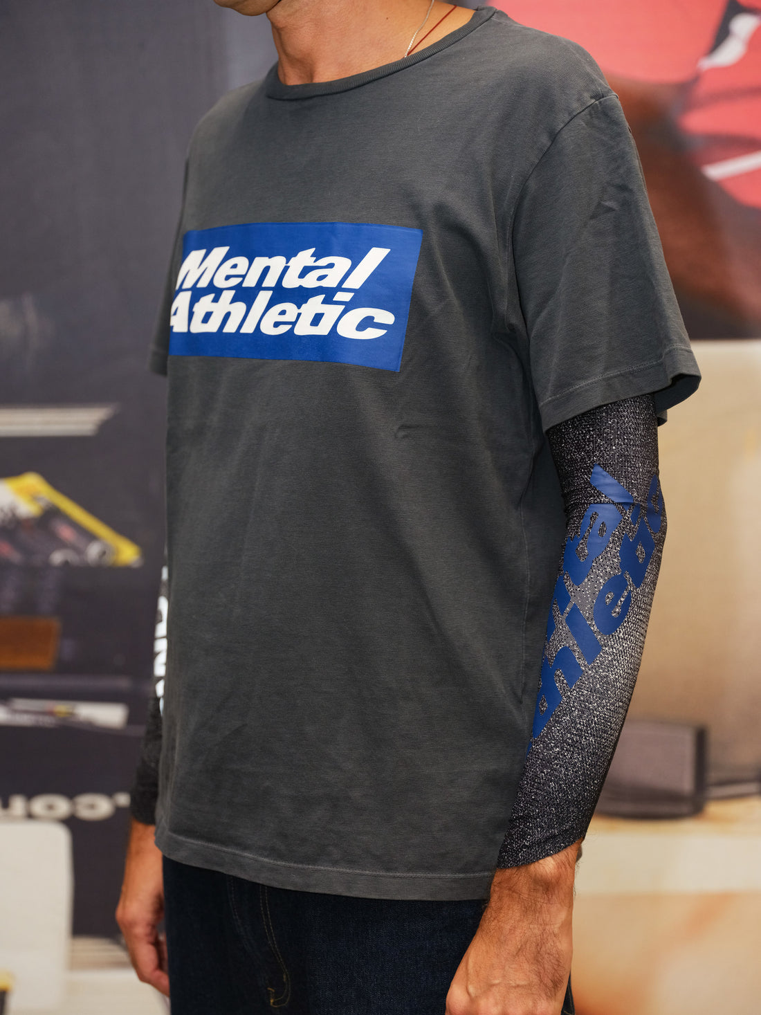 Lifestyle photo with WIND RUSH ARM SLEEVES Mental Athletic styled with branded tee, performance sleeves for ultra running