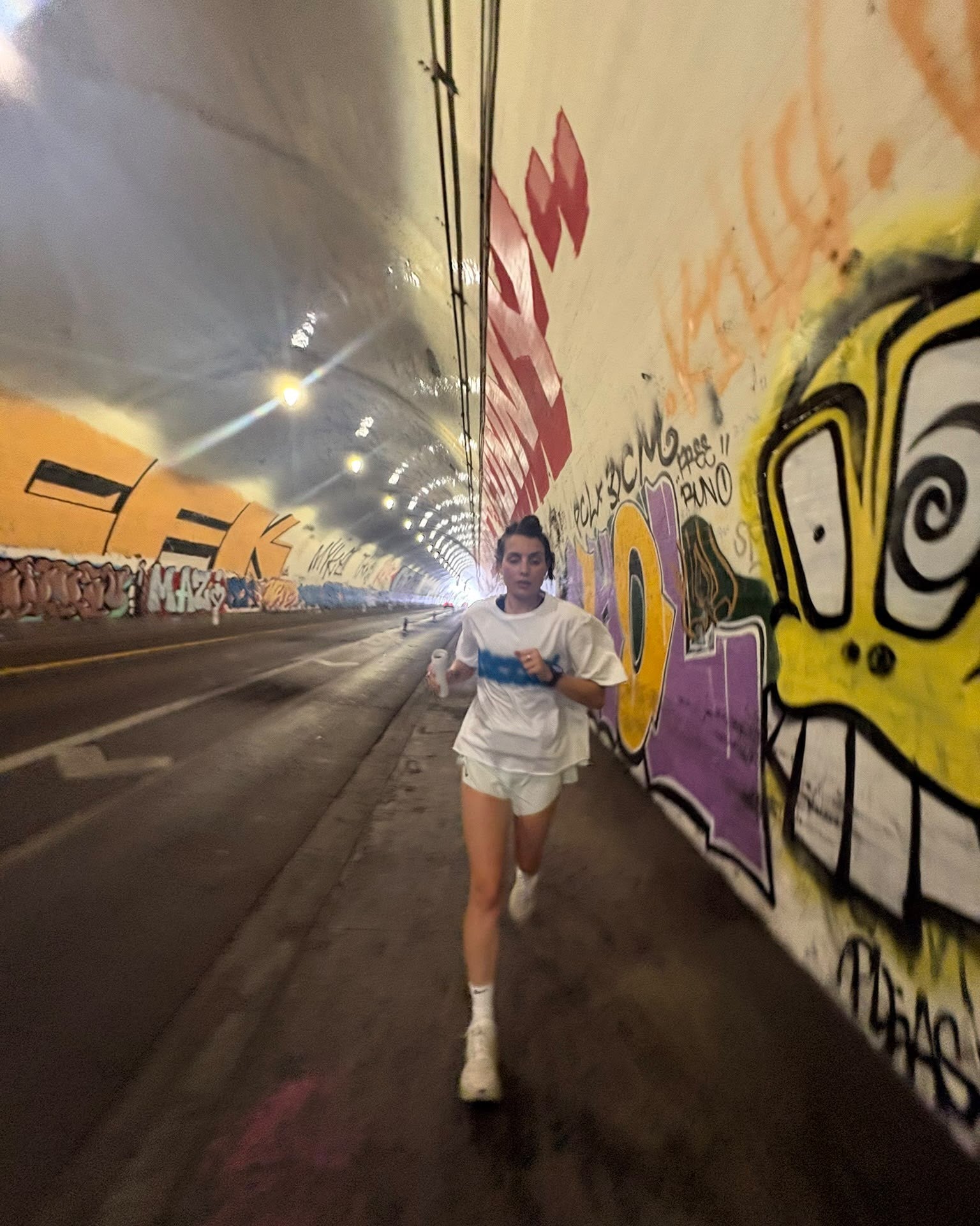 Mental Athletic white cotton t-shirt worn on body, front lifestyle view.