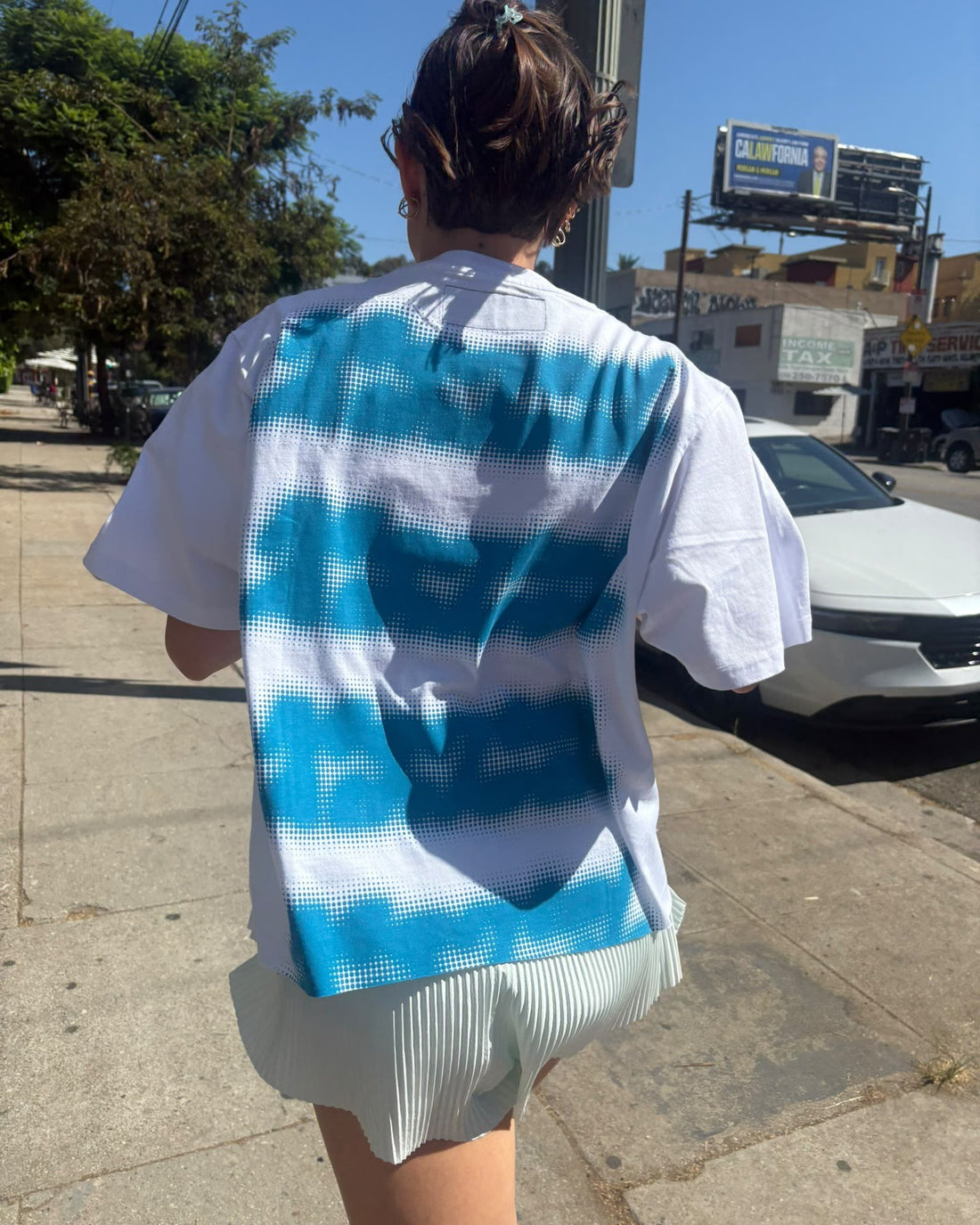 Mental Athletic white cotton t-shirt worn on body, back lifestyle view.