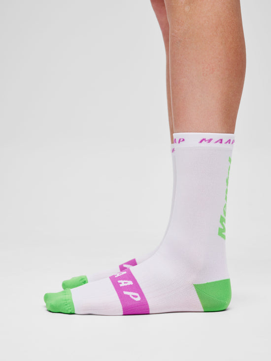 Mental Athletic x MAAP white Team Socks with green and pink graphics, worn on body, side view.