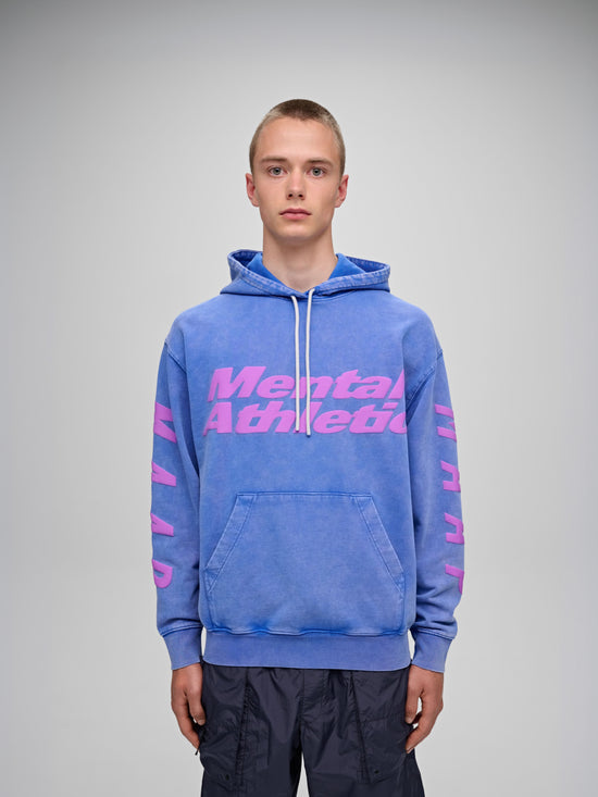 Mental Athletic x MAAP blue cotton hoodie with pink reflective graphics, worn on body, front view.