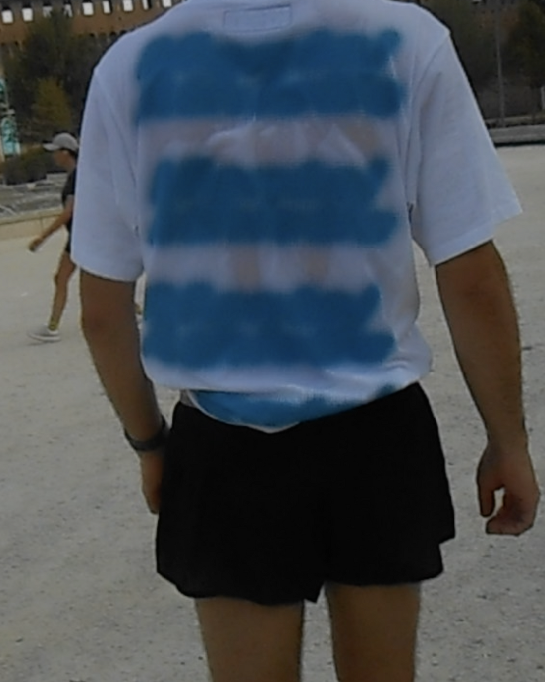 Mental Athletic white cotton t-shirt worn on body, back lifestyle view.
