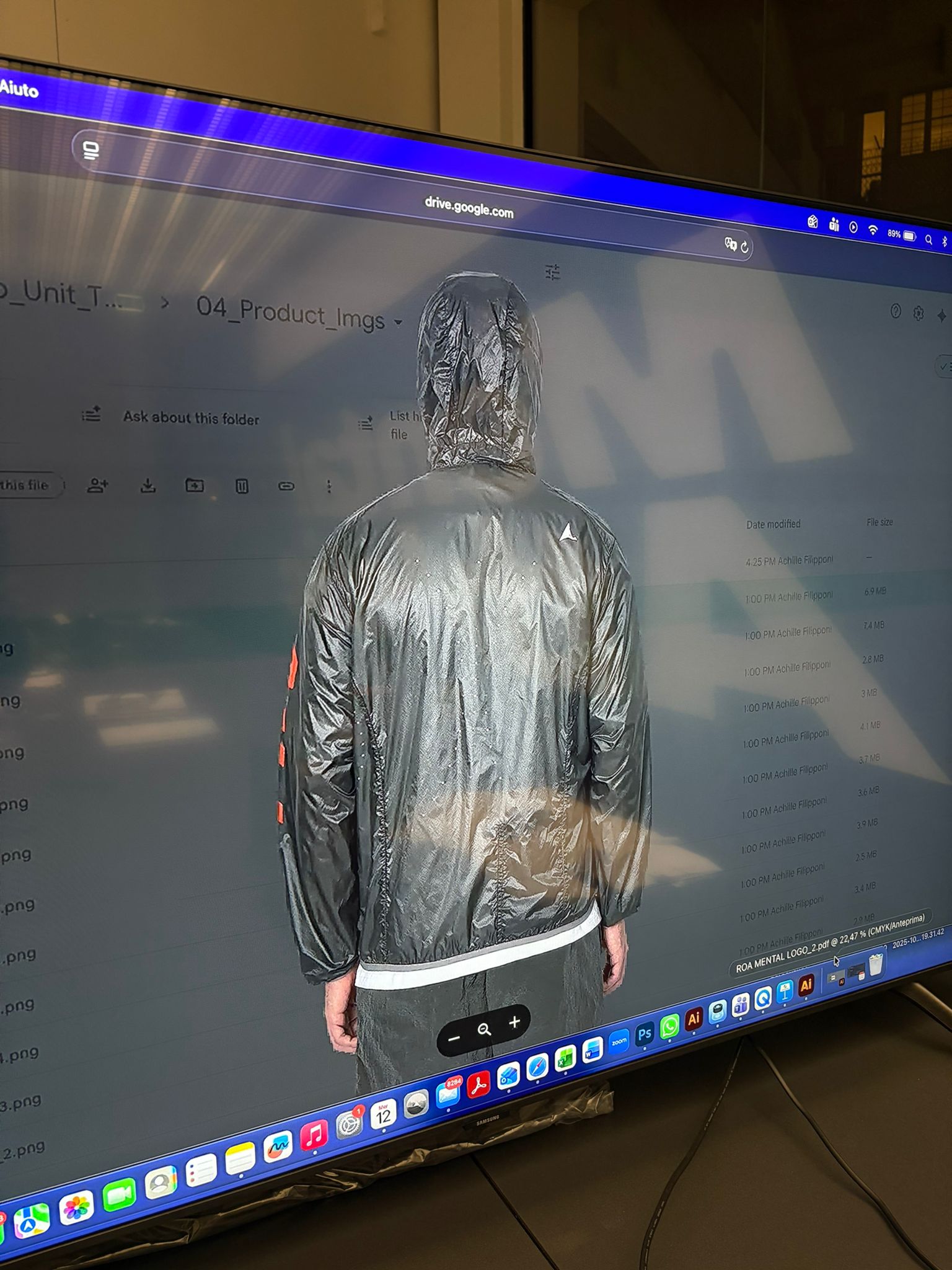 Three-quarter view of the jacket worn with hood up, showing fit and lightweight structure.