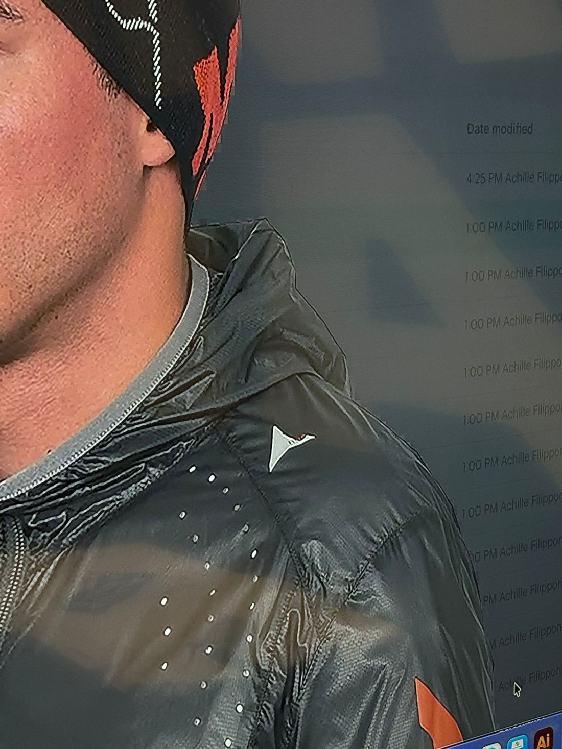 Close-up of the chest and collar area while worn, showing fabric texture and zipper detail.
