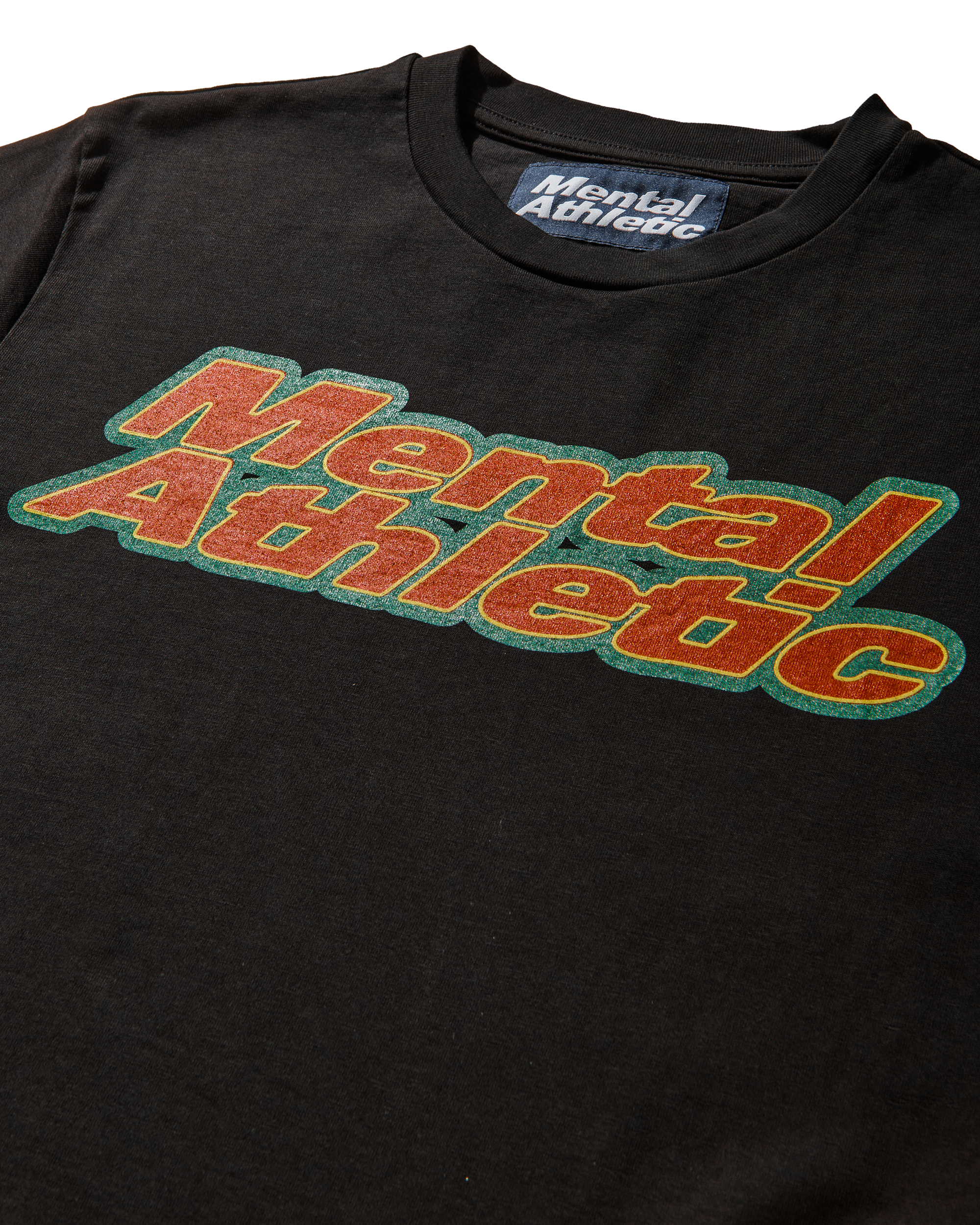 Mental Athletic x AFE black t-shirt detail of chest box logo in orange and green.