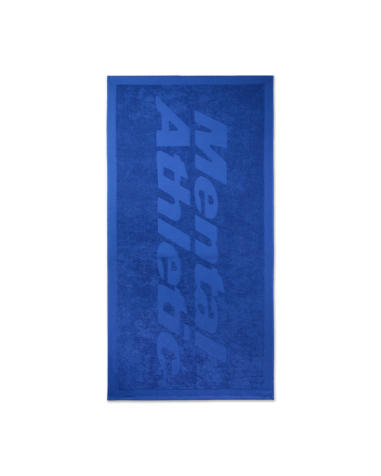 Front view of the blue Mental Athletic jacquard towel, featuring a large tone-on-tone logo across the surface.