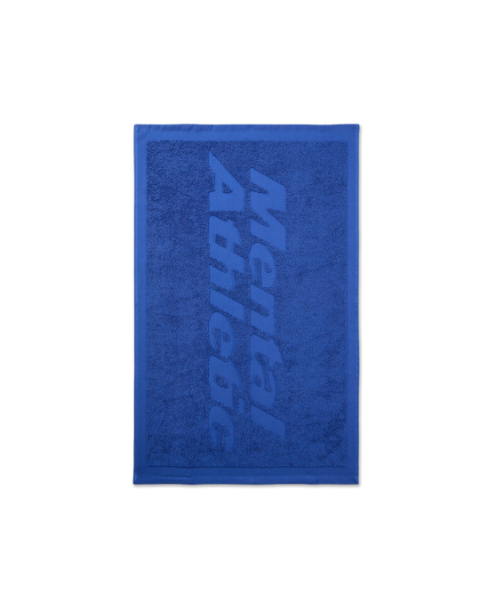 Front view of the small blue Mental Athletic jacquard towel, featuring a large tone-on-tone logo across the surface.