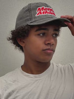 Mental Athletic washed black cotton cap worn on head, lifestyle view.